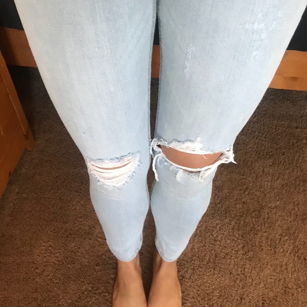 Light wash distressed denim jeans